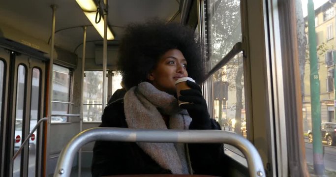 beautiful woman with afro haircut going around in the city. Lifestyle urban glimpses