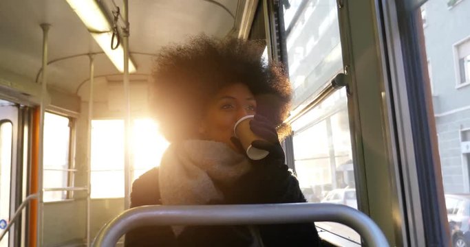 beautiful woman with afro haircut going around in the city. Lifestyle urban glimpses