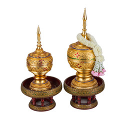 Fototapeta na wymiar golden casket with jasmine garland on top of Thai style isolated with white background