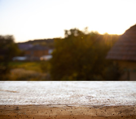 wooden empty table on the background of a blurred forest garden park