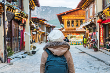 Young woman traveler walking in the old town, Shangri-la, Travel lifestyle concept