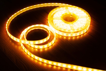 yellow-orange led strip for home decorative light on a dark background