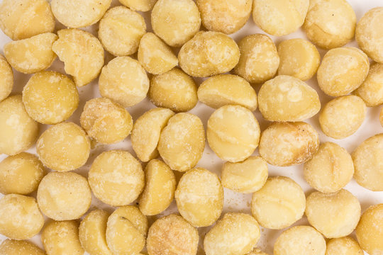 background of roasted and salted macadamia nuts