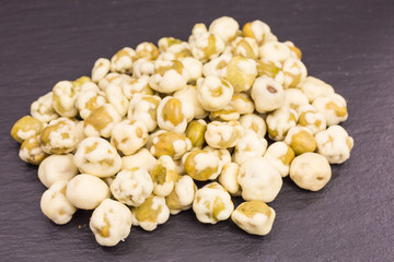 heap of crunchy peas with sea salt as a healthy snack