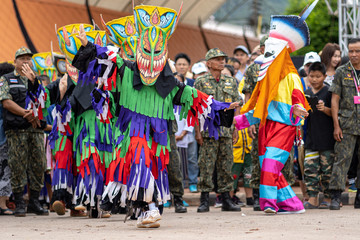 Naklejka premium LOEI, THAILAND - JULY 6, 2019 : Phi Ta Khon Festival on JULY in Loei, Thailand. Young people dress in spirit and wear a mask, Ghost Festival in Dan Sai vilage, LOEI in Thailand ..
