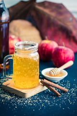 Glass of healthy bael tea with cinnamon, appel and honey