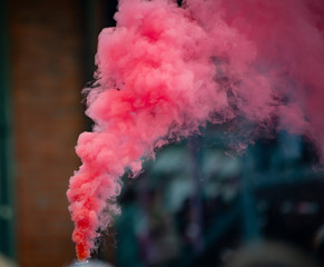 Colorful pink smoke from smoke bomb