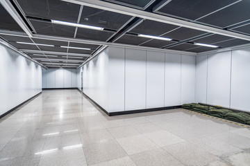 Blank advertising display in subway station underpass public area