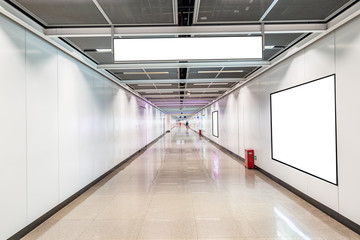 Blank advertising display in subway station underpass public area