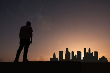 traveler in front of city skyline of los angeles in united states