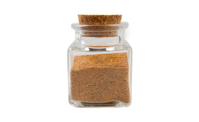 herb or herbal pepper mix in glass  jar on isolated on white background. front view. spices and food ingredients.