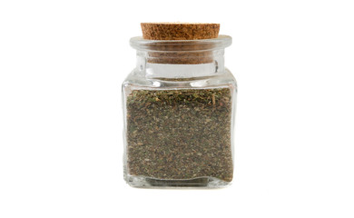 green savory mix or Chubritsa in glass  jar on isolated on white background. front view. spices and food ingredients.
