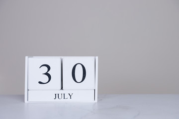 July Date Cube White Background