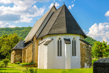 Fototapeta na wymiar A small church in the mountains on a sunny day in Slovakia.