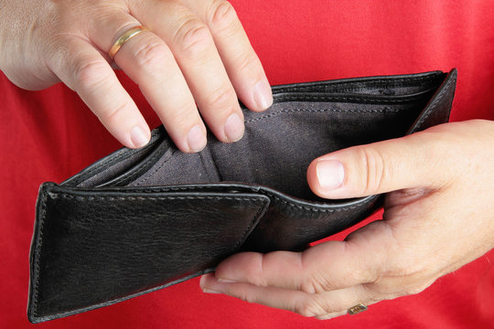 Man holding empty wallet. Deception, poverty, debts