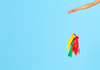 Doll hand with popped balloons. Disappointment and ruined illusion idea
