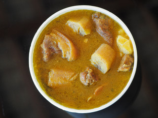 Sancocho soup. View from above. Disposable tableware.