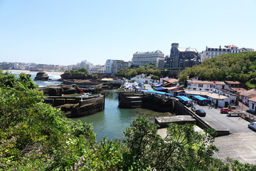 France. The rocky coast with harbor of Biarritz