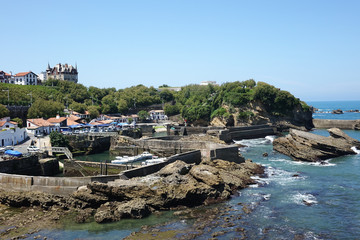 France. The rocky coast with harbor of Biarritz