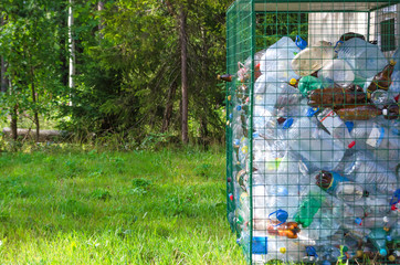 concept of separate garbage collection. plastic bottles separate from the rest of the trash. waste. pollution and environmental protection and ecology. copy space.