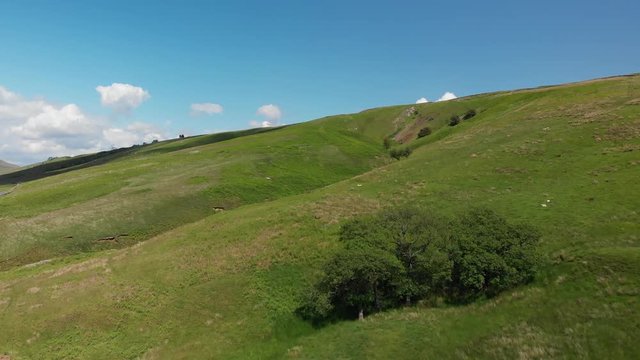Flying across Barbon Beck Valley, Carnforth, Lancashire. This shot moves gently forward across stunning and undulating green landscape.