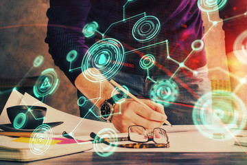 Man's hands working with notes background. Social networking scheme . Mixed media