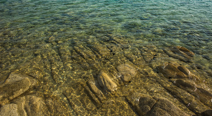rocky stone shallow water waterfront background 
