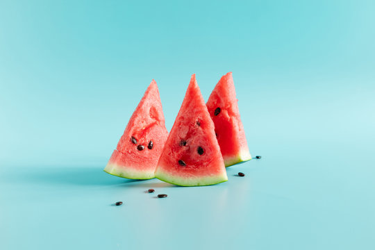 Sliced watermelon on light blue background. Watermelon slice. Summer concept.