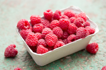 Freshly picked raspberries in box