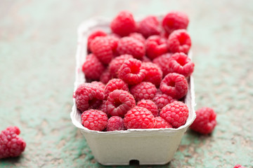 Freshly picked raspberries in box