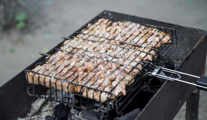 Closeup of the meat roasted in the open fire