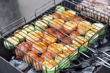 Closeup of the marrow squashes seasoned with red pepper roasted in the open fire