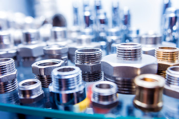 Hosepipe fittings on the table. Plumbing pipeline spare parts.