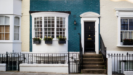 Coloured painted house terraces in London, 2017. Squared format.