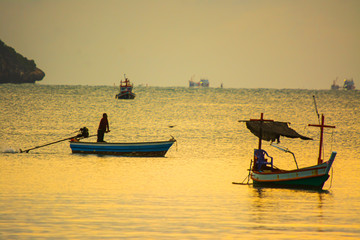 Small fishing boats in  the sea sea in Twilight time