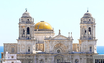 Fototapeta na wymiar The Cathedral of the Holy Cross by the seaside. City of Cadiz, Andalusia, Spain