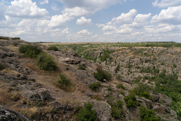 Fototapeta na wymiar Large granite canyon. Village Aktove. Ukraine. Beautiful stone landscape.