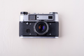 Old vintage retro single silver photo film camera copy space top view flat lay on white background