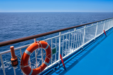 Ferry cruise railing in a blue ocean buoy