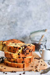 Vanilla bread with chocolate drops on the kitchen table. Slices of cake.