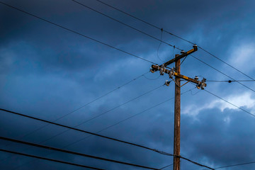 A Telephone Pole with A Stormy Sky