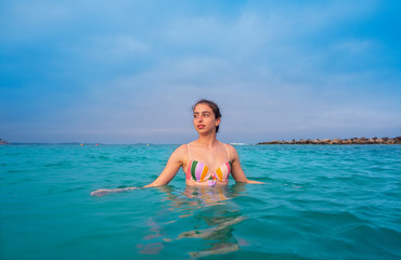 Young woman girl bath in the Ibiza beach