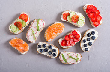 Variation of toast with fruit , vegetable and salmon