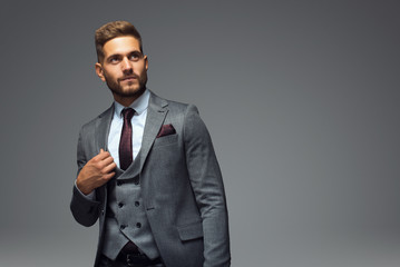 Stylish young man in suit and tie. Business style. Fashionable image. Office worker. Sexy man...