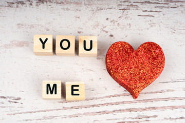 you and me written on wooden cubes