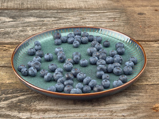 Delicious juicy ripe blueberries .On different background