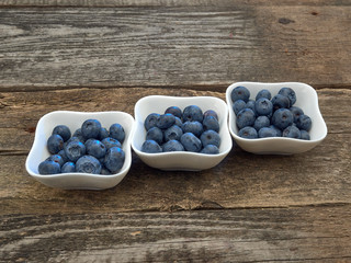 Delicious juicy ripe blueberries .On different background