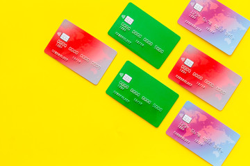 business with credit cards on office desk yellow background top view mockup