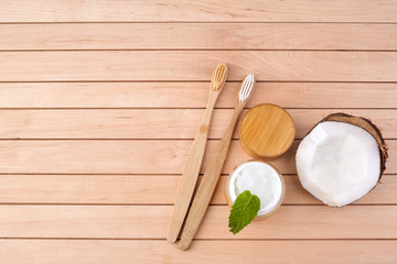 Coconut oil and mint homemade toothpaste, eco friendly bamboo toothbrush, natural healthcare.