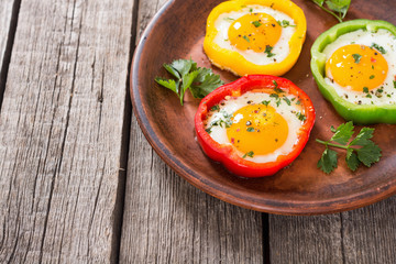 Yellow , red and green pepper with fried eggs